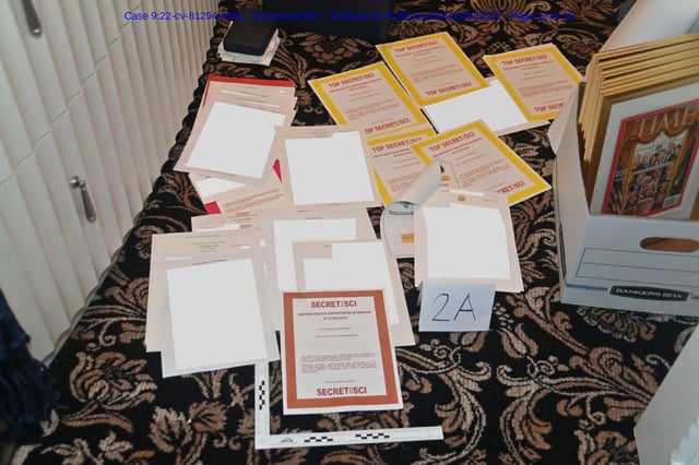 Image contained in a court filing by the Department of Justice on Aug. 30, 2022 of a redacted FBI photograph of certain documents and classified cover sheets recovered from a container in the “45 office” seized during the Aug. 8 search by the FBI of former President Donald Trump's Mar-a-Lago estate in Florida. According to the filing the “classification levels ranged from CONFIDENTIAL to TOP SECRET information, and certain documents included additional sensitive compartments that signify very limited distribution. In some instances, even the FBI counterintelligence personnel and DOJ attorneys conducting the review required additional clearances before they were permitted to review certain documents.”