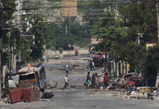 Armed gang members walk through the streets of in Port-au-Prince, Haiti. File photo: Reuters
