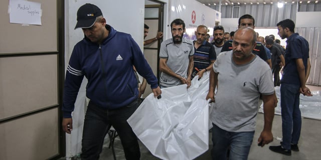 The bodies of Palestinians killed during an Israeli strike on an area designated for displaced people, at the Tel al-Sultan clinic in Rafah, southern Gaza Strip, on May 27, 2024.