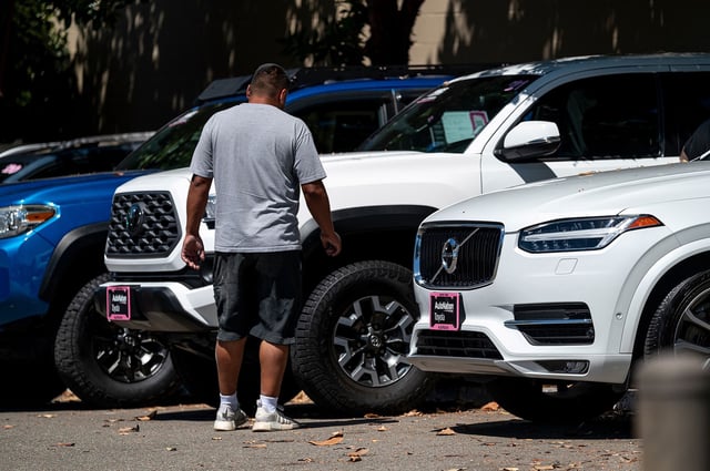 A customer looks at vehicles for sale at an AutoNation Toyota dealership in Hayward, California, US, on Monday, June 24, 2024. The hack that's disrupted business at thousands of car dealerships in North America is now in the process of getting resolved, the targeted software provider CDK Global said.