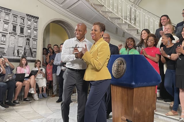 Mayor Eric Adams brought a toy plane to his budget announcement with City Council Speaker Adrienne Adams. He had told reporters that they would "land the plane."