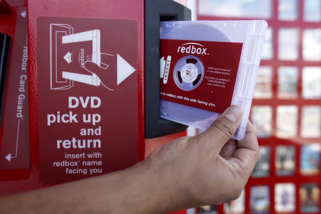 A rental DVD is dispensed from a Redbox at a 7-Eleven in Los Angeles on August 7, 2009. Chicken Soup for the Soul Entertainment, the owner of DVD rental operator Redbox, filed for Chapter 11 bankruptcy protection, Friday, June 28, 2024. (AP Photo/Damian Dovarganes, File)