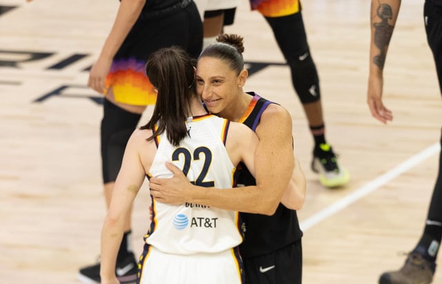 Phoenix Mercury guard Diana Taurasi (3) embraces Indiana Fever guard Caitlin Clark (22) before tipoff on June 30, 2024, at Footprint Center in Phoenix.