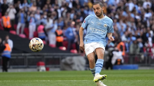 Manchester City's Bernardo Silva shoots to score from the penalty spot during the English FA Community Shield final soccer match between Arsenal and Manchester City at Wembley Stadium in London, Sunday, Aug. 6, 2023. (AP Photo/Kirsty Wigglesworth)