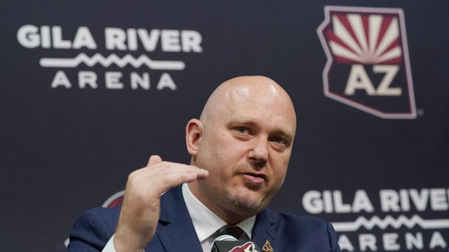 FILE - Arizona Coyotes new head coach Andre Tourigny speaks during an NHL hockey news conference at Gila River Arena in Glendale, Ariz., July 1, 2021. The Coyotes have signed coach André Tourigny to a three-year contract extension, ensuring he will be at the forefront of the franchise's rebuilding process. Terms of the deal announced Wednesday, Aug. 23, 2023, were not released. (AP Photo/Ross D. Franklin, File)