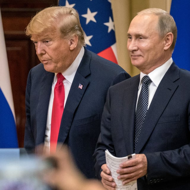 Donald Trump (L) and Russian President Vladimir Putin arrive to waiting media during a joint press conference after their summit on July 16, 2018 in Helsinki, Finland. The Kremlin on Wednesday said talks are not underway between Putin and former U.S. President Trump on possible conditions for peace in the Ukraine war.
