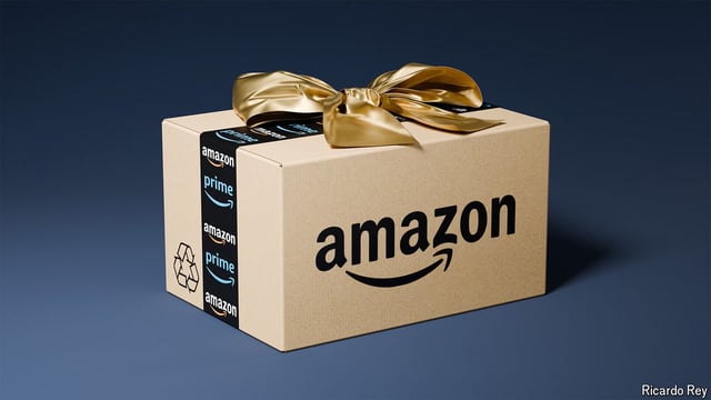 An Amazon box wrapped with a gold bow