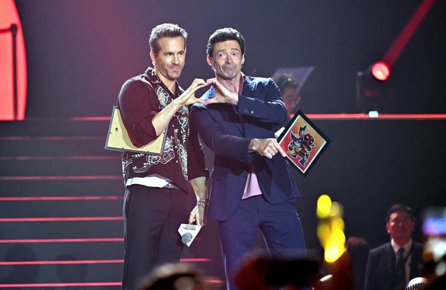 Australian actor Hugh Jackman (R) and US-Canadian actor and producer Ryan Reynolds (L) pose during a red carpet event to promote their new film 'Deadpool & Wolverine' in Seoul on July 4, 2024.
