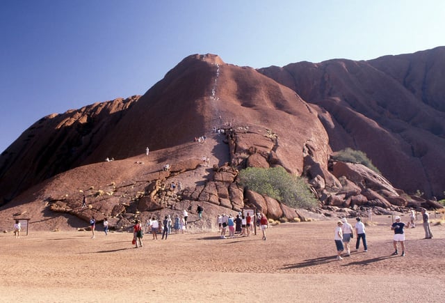 Alice Springs is an entryway to major tourist attractions in Australia’s outback, including the giant red sandstone monolith of Uluru. Photo: Getty Images
