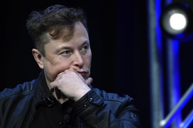 Tesla and SpaceX chief executive officer Elon Musk listens to a question as he speaks at the SATELLITE Conference and Exhibition in Washington, March 9, 2020. A Delaware judge heard arguments Monday, July 8, 2024, over a massive and unprecedented fee request by lawyers who argued that a massive and unprecedented pay package for Tesla CEO Musk was illegal and should be voided. (AP Photo/Susan Walsh, File)