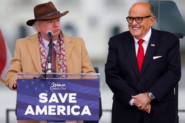 Attorney John Eastman, left, speaks next to Rudy Giuliani, as Trump supporters gather ahead of the president's speech to contest the certification by the US Congress of the results of the 2020 presidential election on the Ellipse on January 6, 2021.