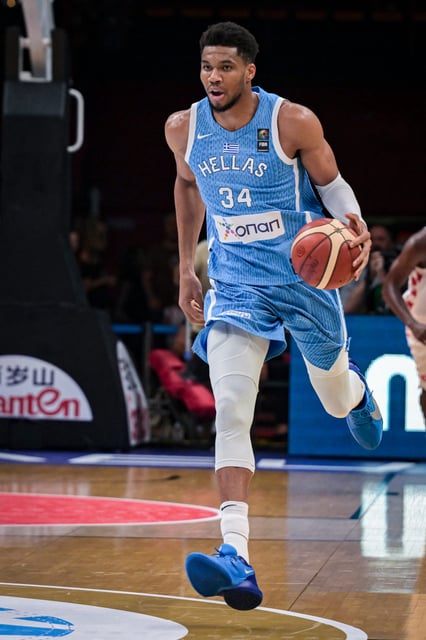 Greece's Giannis Antetokounmpo dribbles the ball during the 2024 FIBA Olympic Qualifying Tournament semi-final basketball match between Greece and Croatia at the Peace and Friendship Stadium in Athens, on July 7, 2024. (Photo by Aris MESSINIS / AFP) (Photo by ARIS MESSINIS/AFP via Getty Images)
