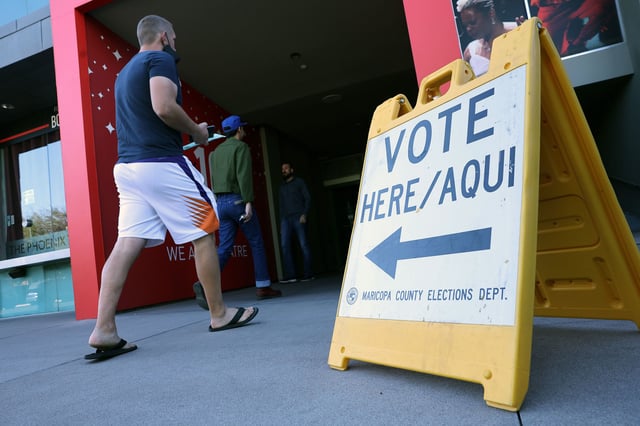 Voters arrive to cast their ballots at the Phoenix Art Museum on November 08, 2022 in Phoenix, Arizona.