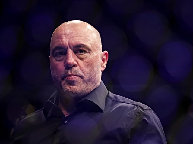 JACKSONVILLE, FLORIDA - APRIL 09: Joe Rogan looks on during the UFC 273 event at VyStar Veterans Memorial Arena on April 09, 2022 in Jacksonville, Florida. (Photo by James Gilbert/Getty Images)