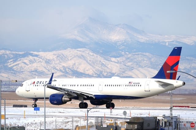 A Delta Airlines jetliner taxis on a runway at Denver International Airport after a winter storm swept through the region on Jan. 16, 2024, in Denver. Delta reports earnings on Thursday, July 11, 2024. (AP Photo/David Zalubowski)