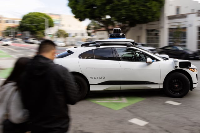 A Waymo autonomous vehicle turning onto Mission Street in San Francisco, on November 17, 2023. A man slashed tires on 17 Waymo robotaxis last month, the San Francisco District Attorney said Thursday. But the high-tech vehicles’ cameras captured footage that led to his arrest. Ronaile Joshua Burton, 36, pleaded not guilty to vandalism charges at his arraignment Wednesday. The district attorney’s office said Burton targeted the self-driving Waymo vehicles between June 24 and June 26. Each count alleges damage exceeding $400.