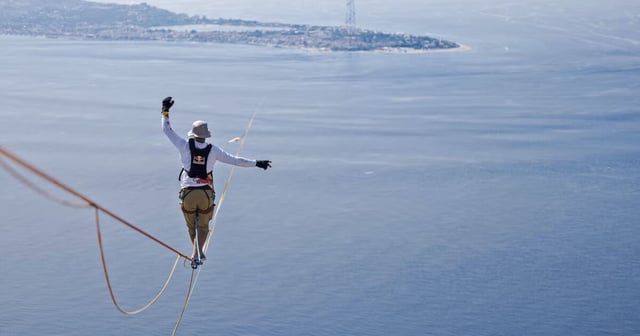Jaan Roose attempting the slackline world record, over 800 ft (244 m) above the Messina Strait