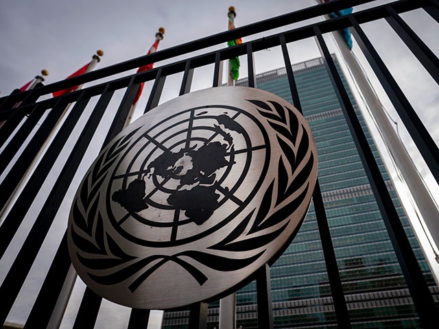 The symbol of the United Nations is displayed on the main gate outside UN headquarters, Feb. 24, 2022, in New York. The United States is spearheading the first United Nations resolution on artificial intelligence, aimed at ensuring the new technology is “safe, secure and trustworthy” and that all countries, especially those in the developing world, have equal access. The draft General Assembly resolution aims to close the digital divide between countries and make sure they are all at the table in discussions on AI. (AP Photo/John Minchillo, file)