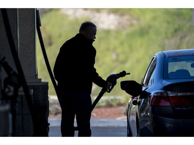 A customer pumps gas at a gas station in Hercules, California, US, on Thursday, March 14, 2024. Disruptions on the world's major trade routes, refinery closures and resurgent demand are pushing up global fuel prices and making forecasts difficult in the run-up to a US presidential election in which inflation will be a key issue. Photographer: David Paul Morris/Bloomberg