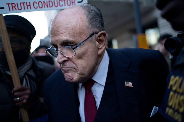 Former New York Mayor Rudy Giuliani departs the U.S. District Courthouse after he was ordered to pay $148 million in his defamation case in Washington, U.S., December 15, 2023.