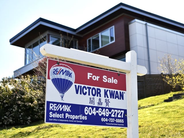 A 'For Sale' sign  displayed outside a home in Vancouver.