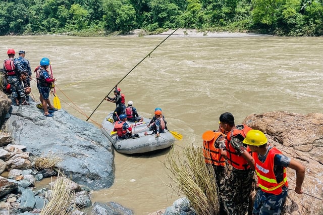 Dozens of rescuers have spent hours struggling to comb the raging Trishuli river with rafts, sensor equipment and dive teams to find any trace of the passengers or the vehicles