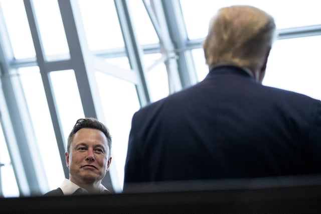 Tesla and SpaceX Chief Executive Officer Elon Musk talks with President Donald Trump in 2020. On Saturday, Musk endorsed Trump’s presidential bid after the former President was shot during an election rally.