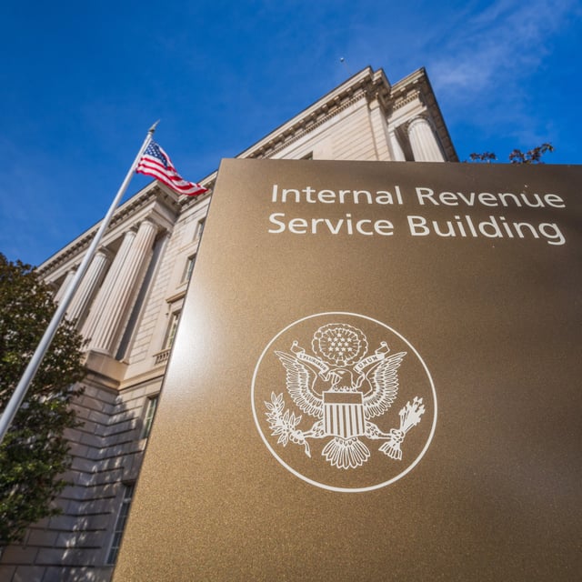 The U.S. Flag flys above the International Revenue Service headquarters building on January 3, 2024, in Washington, D.C. The agency warned taxpayers not to fall for false information on social media.
