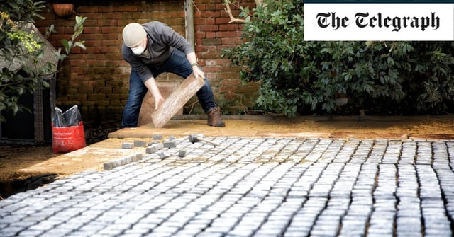Laying slabs and cobbles to create a driveway can cause flooding problems