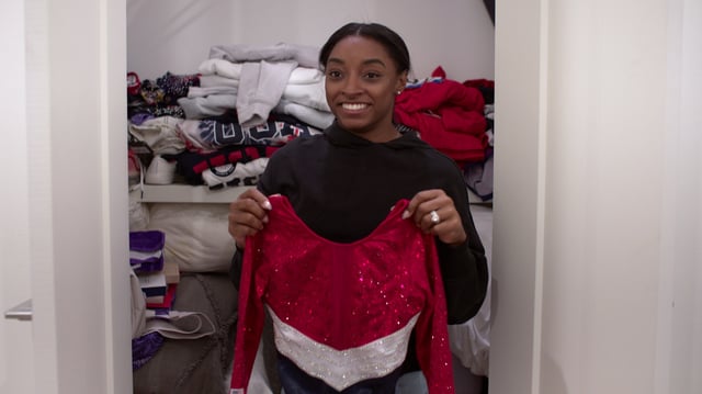 Gymnast Simone Biles takes documentary cameras into a closet housing memorabilia from the Tokyo 2020 Olympics.