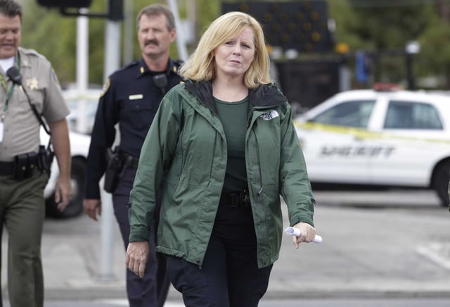 Santa Clara County Sheriff Laurie Smith walks to a news conference in Cupertino in 2011. A former sheriff’s captain was convicted of participating in a scheme to acquire concealed gun permits for security agents in exchange for campaign money for Smith’s reelection.