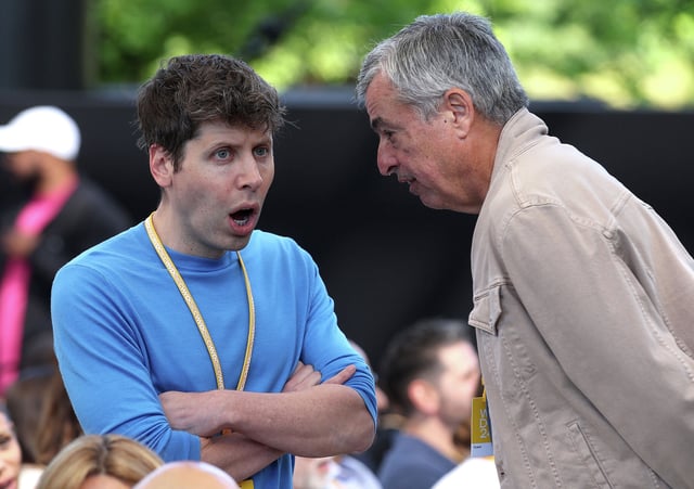 OpenAI CEO Sam Altman (L) talks with Apple executive Eddy Cue (R) during the Apple Worldwide Developers Conference on June 10, 2024 in Cupertino, California. 