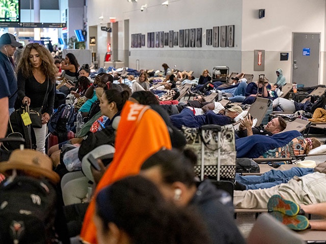 Travelers at George Bush Intercontinental Airport (IAH) in Houston, Texas, US, on Saturday, July 20, 2024. Airlines around the world experienced disruption on an unprecedented scale after a widespread global computer outage grounded planes and created chaos at airports. Photographer: David Paul Morris/Bloomberg via Getty Images