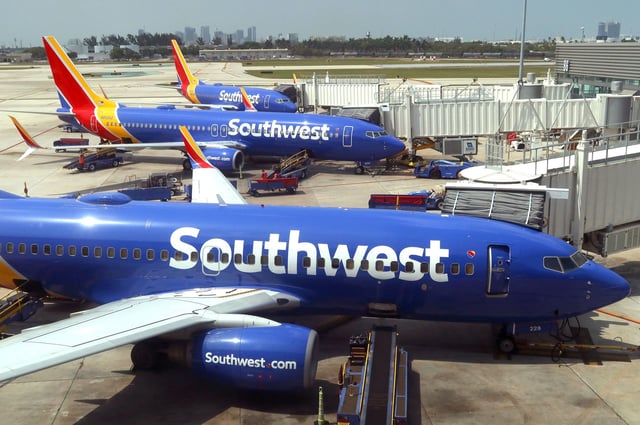 FORT LAUDERDALE, FL - MAY 18: Southwest Airlines airplanes are serviced at their gates at Fort Lauderdale-Hollywood International Airport on May 18, 2024, in Fort Lauderdale, Florida.  (Photo by Gary Hershorn/Getty Images)