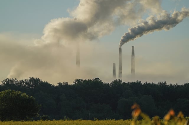 Pollution is spewing from the stacks at the Miami Fort Power Plant just after sunrise at the Oxbow Nature Conservancy in Lawrenceburg, Indiana, on May 31, 2024.