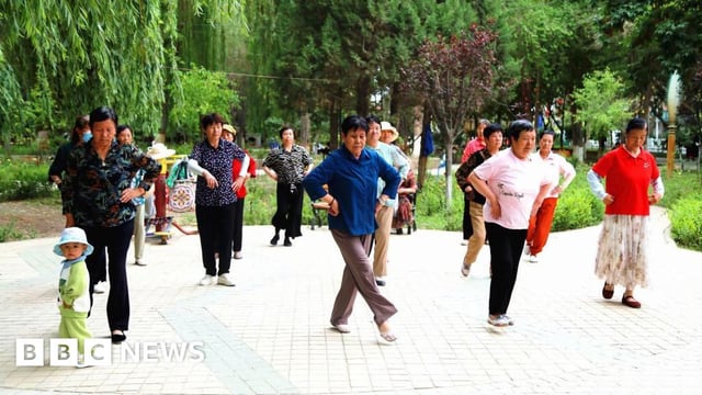 Women dancing at a square in Aksu prefecture, Xinjiang