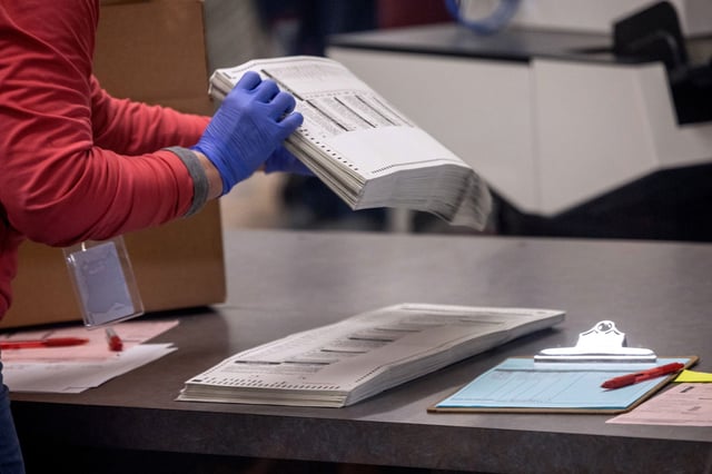 Election workers sort ballots at the Maricopa County Tabulation and Election Center on November 09, 2022 in Phoenix, Arizona. A day after the Midterm elections, Arizona election officials continue counting votes in close state races.