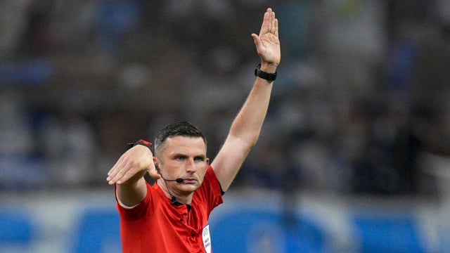 Referee Michael Oliver gives directions during the Champions League soccer match between Marseille and Panathinaikos at the Velodrome stadium in Marseille, southern France, Tuesday, Aug. 15, 2023. (AP Photo/Daniel Cole)
