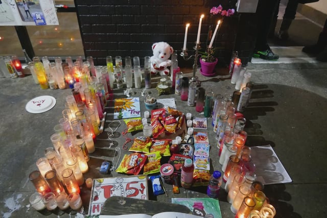 The memorial outside Gill's building on St. Marks Avenue in Crown Heights