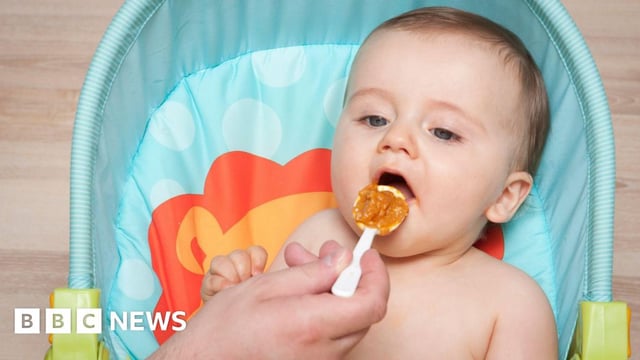 A baby being fed