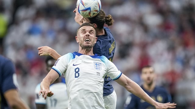 FILE - England's Jordan Henderson, front, heads for the ball with France's Adrien Rabiot during the World Cup quarterfinal soccer match between England and France, at the Al Bayt Stadium in Al Khor, Qatar, Saturday, Dec. 10, 2022. Moving to Saudi Arabia hasn’t stopped Jordan Henderson getting called up by England. The former Liverpool captain was included in the 26-man squad on Thursday, Aug. 31, 2023 for upcoming games against Ukraine and Scotland even though he now plays for Al-Ettifaq. He is one of the growing number of top players to take lucrative sums of money in the oil-rich kingdom. (AP Photo/Christophe Ena, File)
