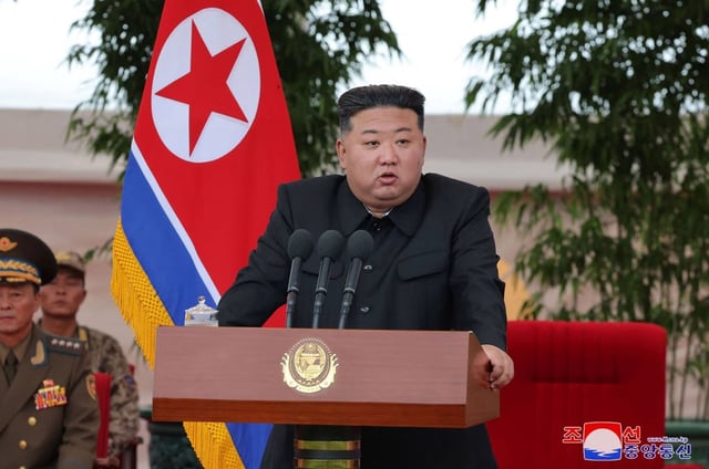 Kim Jong-un delivers a speech as he visits the helicopter unit of the Air Force of the Korean People’s Army that rescued 4,200 people in flood-hit areas in North Pyongan Province, at an undisclosed location. Photo: KCNA/KNS/AFP