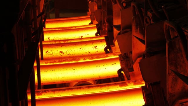 close up of glowing steel casting in steel mill