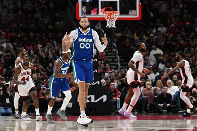 JaVale McGee #00 of the Dallas Mavericks reacts after his three point basket in the second half against the Dallas Mavericks at United Center on December 10, 2022 in Chicago, Illinois.