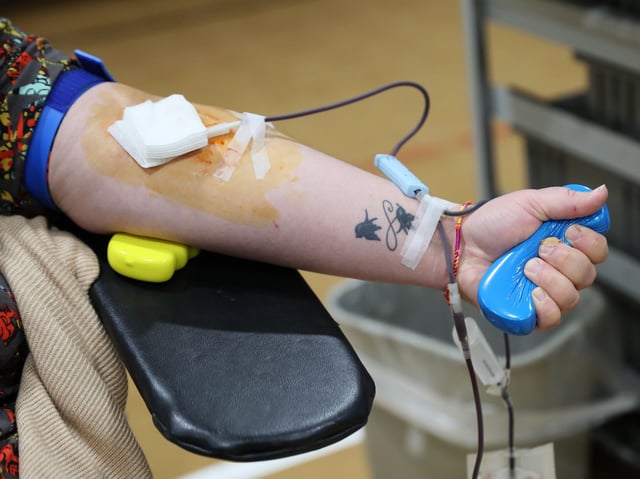 Katie Albright of Waukesha donates blood. Fox River Christian Church in Waukesha hosted a blood drive on Good Friday conducted by a team from Versiti Blood Center of Wisconsin on April 10, 2020.