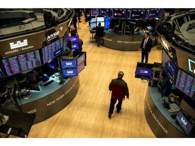 Traders work on the floor of the New York Stock Exchange (NYSE) in New York, US, on Friday, Feb. 16, 2024. Wall Street is ending the week on a bit of a sour note, with stocks and bonds falling after economic data continued to fuel speculation the Federal Reserve will be in no rush to cut interest rates. Photographer: Michael Nagle/Bloomberg