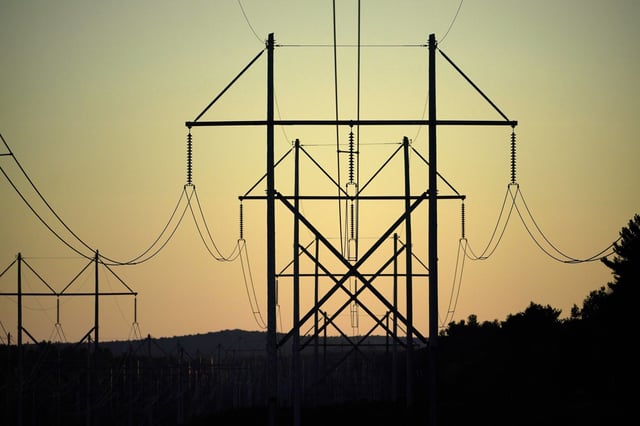 Central Maine Power transmission lines are seen on Oct. 6, 2021, in Pownal, Maine. More than $2.2 billion will be awarded to projects in 18 states to strengthen the electrical grid against increasing extreme weather, add renewable power and meet a growing demand for electricity for manufacturing and data centers, the Department of Energy announced Tuesday, Aug. 6, 2024. (AP Photo/Robert F. Bukaty, File)