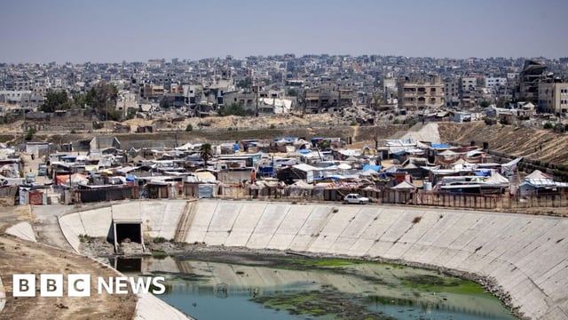 Displaced Palestinians set up their tents next to sewage and a garbage dump on a street in Khan Younis camp in the southern Gaza Strip, 01 August 2024