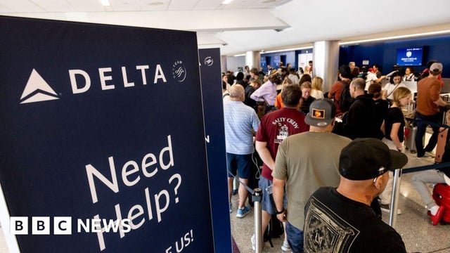 Travelers wait in line at check-in in Terminal 2, Delta Airlines, at Los Angeles airport, on July 19, 2024.