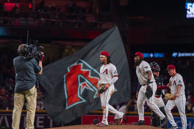 A general view as Arizona Diamondback players celebrate in the ninth inning after beating the Philadelphia Phillies 11-1 during a game at Chase Field in Phoenix on Aug. 10, 2024.